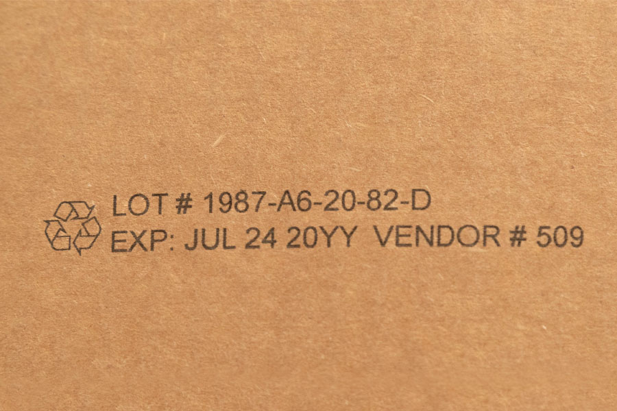 cardboard with lot number, expiration, graphic, and vendor