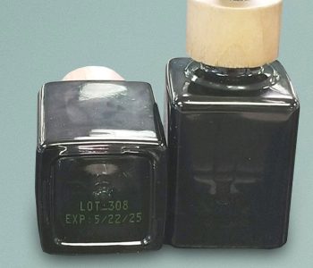 square bottles with lot number and expiration date in yellow ink