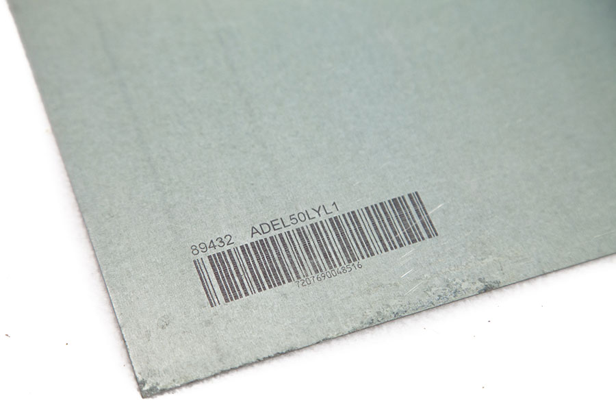grey cardboard with barcode and serial code