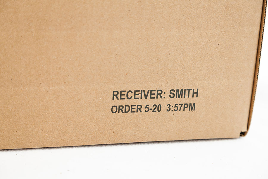 cardboard box with receiver name and order date time